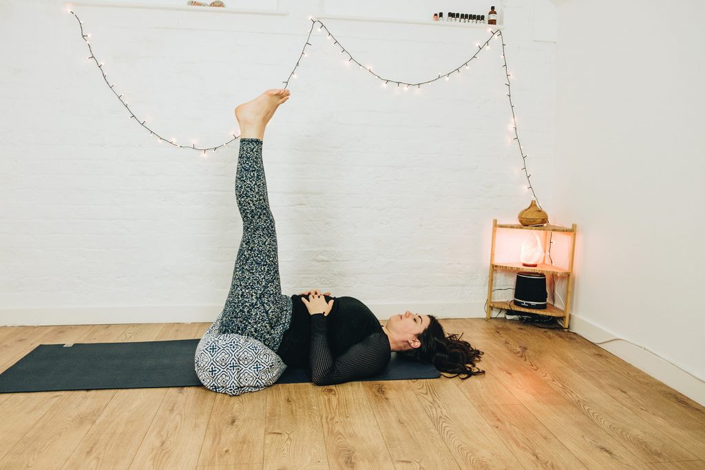 Man doing Legs up the Wall pose Viparita karani stretch exercise